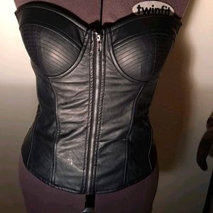 Leather look, zip front corset top.